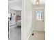 Bright entryway featuring a decorative front door that leads into a bedroom with wood floors at 6402 Friendship Cir, Indianapolis, IN 46268