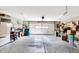 Spacious garage with overhead lighting and ample storage space for vehicles and household items at 6402 Friendship Cir, Indianapolis, IN 46268
