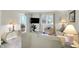 Bright living room with large windows, modern furniture, and neutral decor at 6402 Friendship Cir, Indianapolis, IN 46268
