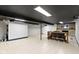Open basement area featuring a bar table with seating and a stone fireplace at 6430 N Rural St, Indianapolis, IN 46220