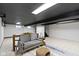Finished basement with a comfy seating area and bonus dining or work space at 6430 N Rural St, Indianapolis, IN 46220
