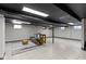 Spacious basement with finished flooring, neutral walls, and ample lighting at 6430 N Rural St, Indianapolis, IN 46220
