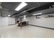 Large basement with an open floor plan, fireplace, bar table, and ample storage at 6430 N Rural St, Indianapolis, IN 46220