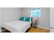 This bedroom features hardwood floors, neutral paint, and natural light at 6430 N Rural St, Indianapolis, IN 46220