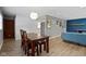 Bright dining area with a contemporary light fixture and hardwood floors at 6430 N Rural St, Indianapolis, IN 46220