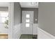 Entryway with gray walls, white trim and a view to the exterior through a white door at 6430 N Rural St, Indianapolis, IN 46220