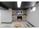 Finished basement with brick fireplace and decorative mantle at 6430 N Rural St, Indianapolis, IN 46220