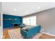 Inviting living room featuring a striking blue accent wall and a cozy fireplace at 6430 N Rural St, Indianapolis, IN 46220