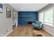 Bright living room with large windows, fireplace, and hardwood floors at 6430 N Rural St, Indianapolis, IN 46220