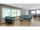 Comfortable living room with hardwood floors and large windows at 6430 N Rural St, Indianapolis, IN 46220