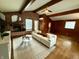 Inviting living room with brick fireplace, vaulted ceilings, and hardwood floors at 6430 N Rural St, Indianapolis, IN 46220