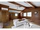 Bright living room featuring vaulted wood ceilings, hardwood floors, and a decorative fireplace at 6430 N Rural St, Indianapolis, IN 46220