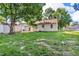 Well maintained backyard with mature trees and grass lawn at 696 W Mill St, Danville, IN 46122