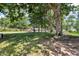 Large backyard with mature trees at 696 W Mill St, Danville, IN 46122