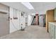Unfinished basement with exposed brick, stairs, drop ceiling, and utility access at 696 W Mill St, Danville, IN 46122