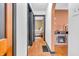 Hallway featuring wood flooring, access to bedroom, and views of the fireplace at 696 W Mill St, Danville, IN 46122
