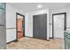 Bright kitchen featuring tile flooring, gray closet, and access to other rooms in the house at 696 W Mill St, Danville, IN 46122