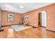 Sunlit living room with hardwood floors, stylish seating, and an arched doorway at 696 W Mill St, Danville, IN 46122