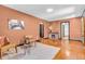 Open living room showcasing hardwood floors, a cozy seating area, and seamless access to other rooms at 696 W Mill St, Danville, IN 46122
