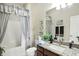 Bathroom featuring granite countertops, modern fixtures, and a shower-tub combination at 712 Disciples Way, Greenwood, IN 46143