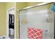 Bathroom shower stall with glass doors, a red accent towel, and walk-in closet at 712 Disciples Way, Greenwood, IN 46143