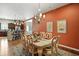 Dining room opening up to the kitchen with an elegant chandelier and hardwood floors at 712 Disciples Way, Greenwood, IN 46143