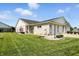 Charming brick home featuring an attached three-car garage and well-maintained lawn at 712 Disciples Way, Greenwood, IN 46143
