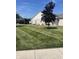 Exterior view of home showcasing the pristine lawn and lovely landscaping at 712 Disciples Way, Greenwood, IN 46143