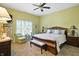 Sunlit main bedroom with a ceiling fan, creating a peaceful retreat within the home at 712 Disciples Way, Greenwood, IN 46143