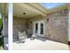 Inviting covered porch with ample seating for relaxing and enjoying the outdoors at 712 Disciples Way, Greenwood, IN 46143