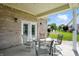 Charming porch features comfortable seating and views of the neighborhood landscaping at 712 Disciples Way, Greenwood, IN 46143