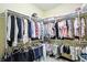 This spacious walk-in closet is organized with racks for hanging and shelving at 712 Disciples Way, Greenwood, IN 46143