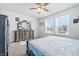 Cozy bedroom features two windows and a vintage dresser with vanity mirror at 7301 Deerberg Dr, Indianapolis, IN 46259