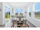 Bright dining room featuring lots of natural light, wood floors and backyard view at 7301 Deerberg Dr, Indianapolis, IN 46259