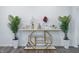 Hallway features a decorative table with flowers, plants, and a pair of gold elephant statues at 7301 Deerberg Dr, Indianapolis, IN 46259