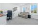 Comfortable home office with a plush couch, desk, hexagon decorations, and a bright window view at 7301 Deerberg Dr, Indianapolis, IN 46259