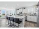 Bright kitchen featuring a large island with seating and stainless steel appliances at 7301 Deerberg Dr, Indianapolis, IN 46259