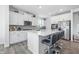 Bright kitchen featuring a large island with seating and stainless steel appliances at 7301 Deerberg Dr, Indianapolis, IN 46259