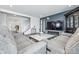 Comfortable living room with hardwood floors, sofas, a TV, and staircase access to the second floor at 7301 Deerberg Dr, Indianapolis, IN 46259