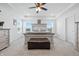 Spacious main bedroom with carpet, tray ceiling, bench, and bright windows at 7301 Deerberg Dr, Indianapolis, IN 46259