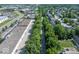 Aerial shot of a street lined with trees, with both residential and commercial areas visible nearby at 8835 Harrison Pkwy, Fishers, IN 46038