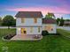 Spacious backyard featuring a stone patio and fire pit, ideal for outdoor gatherings and relaxation at 8835 Harrison Pkwy, Fishers, IN 46038