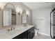 Bathroom featuring dual sinks, marble countertops, and stylish vanity mirrors at 8835 Harrison Pkwy, Fishers, IN 46038
