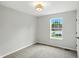 A bright bedroom with neutral walls and carpet, complemented by a well-lit ceiling fan at 8835 Harrison Pkwy, Fishers, IN 46038