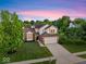 Charming two-story home features a well-manicured lawn, attached garage, and inviting curb appeal at 8835 Harrison Pkwy, Fishers, IN 46038