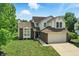 Beautiful two-story house with attached garage, landscaped front yard, and welcoming curb appeal at 8835 Harrison Pkwy, Fishers, IN 46038