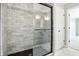 Luxurious shower features stylish tilework, glass doors, and modern fixtures at 8835 Harrison Pkwy, Fishers, IN 46038
