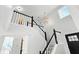 White and black staircase leads to the second floor with lots of natural light at 8835 Harrison Pkwy, Fishers, IN 46038