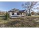 Expansive backyard with patio, showcasing the home's well-maintained lawn and private setting with mature trees at 886 J Mccool Way, Greenwood, IN 46142
