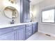 Dual sink bathroom features sleek, modern fixtures, stunning mirrors, and ample counter space at 886 J Mccool Way, Greenwood, IN 46142